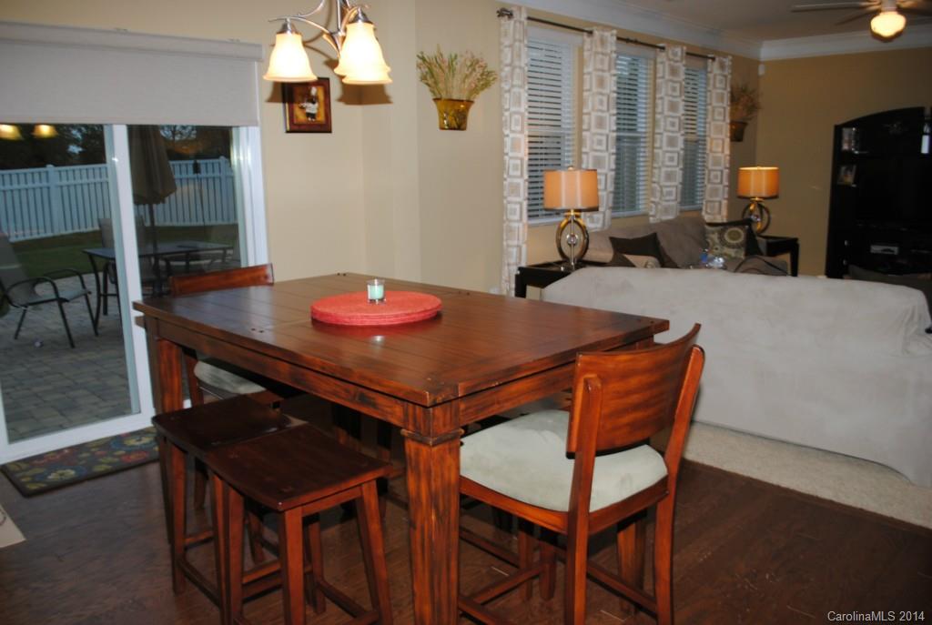 2604 Aldergrove Road Matthews, NC 28105 - Photo 5 of 16 a dining room with a table and chairs