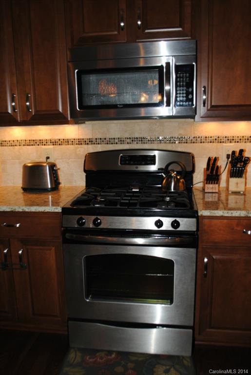 2604 Aldergrove Road Matthews, NC 28105 - Photo 7 of 16 a stove top oven sitting inside of a kitchen