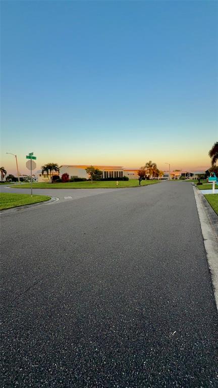 4207 13th Street East Ellenton, FL 34222 - Photo 12 of 15 a view of a lake with sunset in background