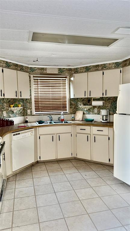 4207 13th Street East Ellenton, FL 34222 - Photo 2 of 15 a kitchen with a stove a sink and a refrigerator
