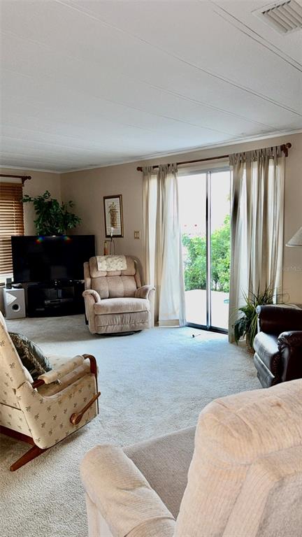 4207 13th Street East Ellenton, FL 34222 - Photo 3 of 15 a spacious bedroom with a bed and a couch