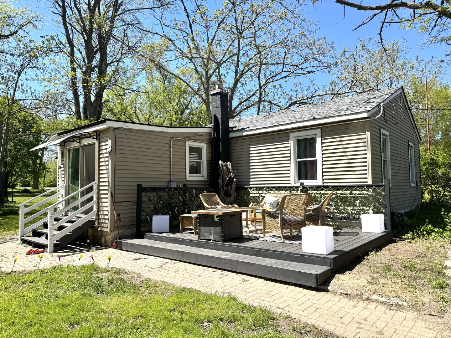 931 South Rawson Bridge Road Cary, IL 60013 - Photo 25 of 36 a wooden bench sitting in front of a house