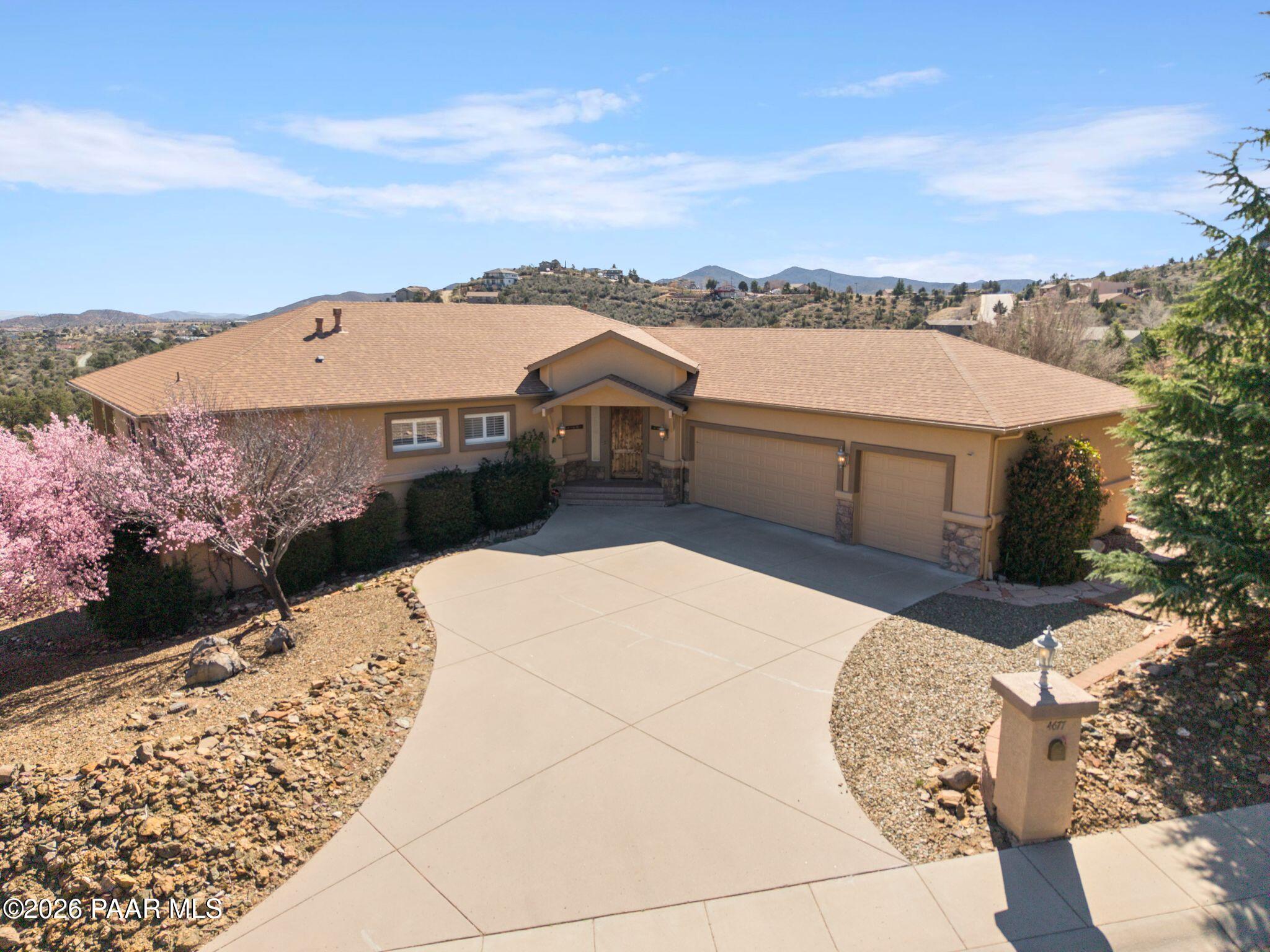 4677 Sharp Shooter Way Prescott, AZ 86301 - Photo 1 of 64 a aerial view of a house with a yard