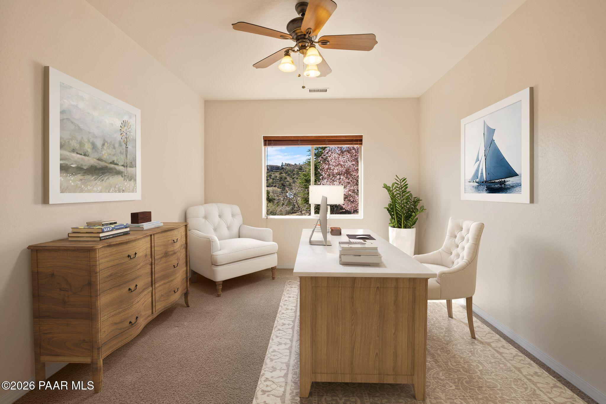 4677 Sharp Shooter Way Prescott, AZ 86301 - Photo 24 of 64 a living room with furniture and a chandelier