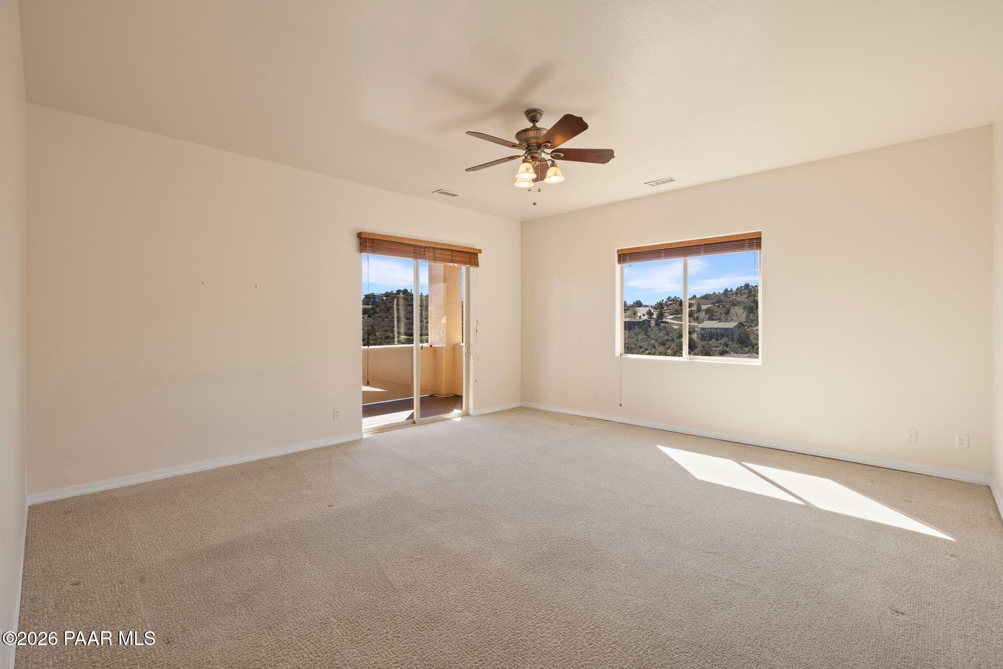 4677 Sharp Shooter Way Prescott, AZ 86301 - Photo 30 of 64 an empty room with windows and fan