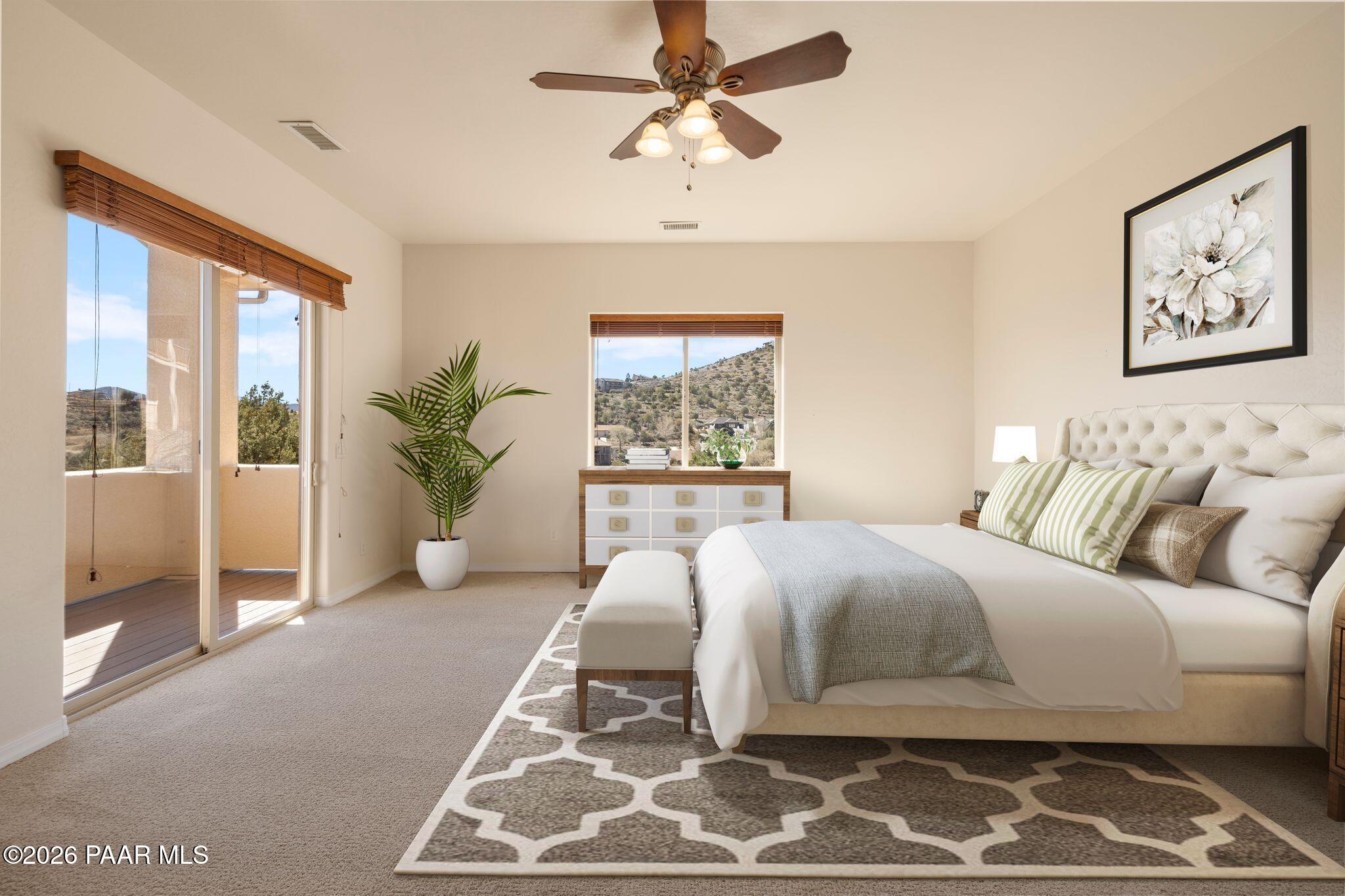 4677 Sharp Shooter Way Prescott, AZ 86301 - Photo 31 of 64 a bedroom with a large bed and a window