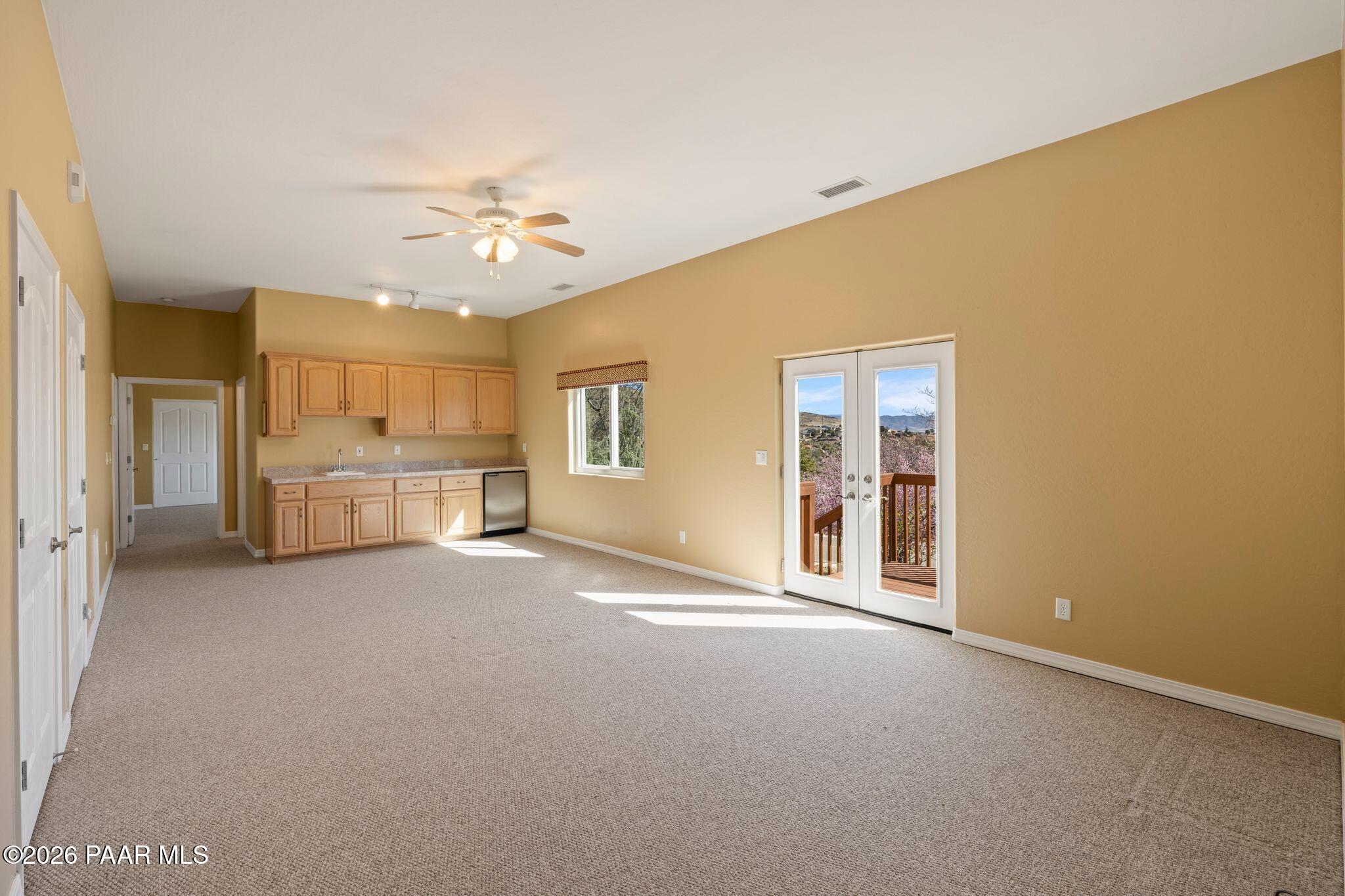 4677 Sharp Shooter Way Prescott, AZ 86301 - Photo 44 of 64 a view of a livingroom with an empty room