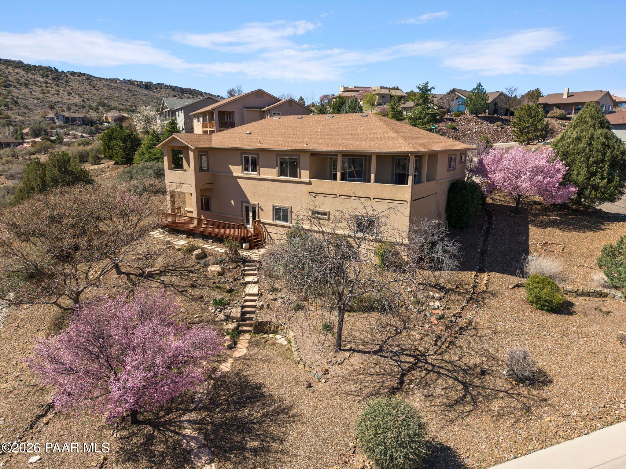 4677 Sharp Shooter Way Prescott, AZ 86301 - Photo 60 of 64 a front view of a house with a yard