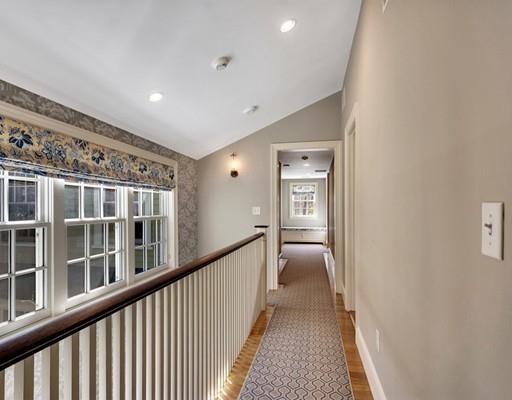 26 Old Farm Road Lincoln, MA 01773 - Photo 12 of 30 a view of a hallway with a livingroom and windows