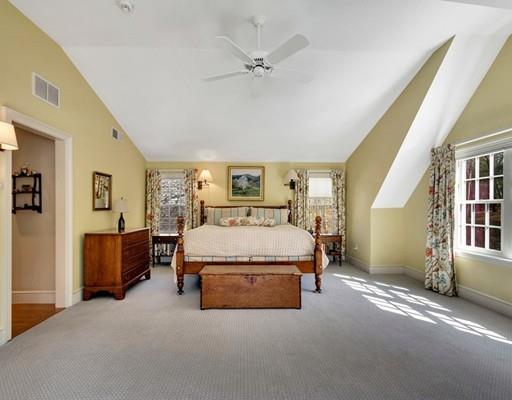 26 Old Farm Road Lincoln, MA 01773 - Photo 13 of 30 a spacious bedroom with a bed and a chandelier