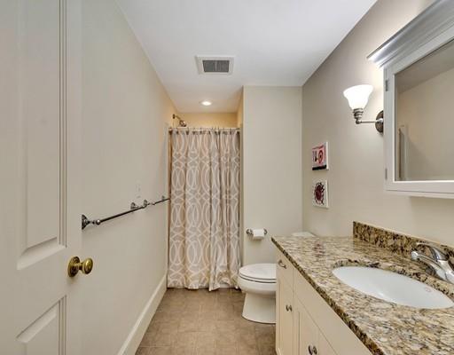 26 Old Farm Road Lincoln, MA 01773 - Photo 17 of 30 a bathroom with a granite countertop sink a toilet and shower