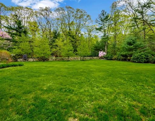 26 Old Farm Road Lincoln, MA 01773 - Photo 30 of 30 a view of a grassy field with trees in the background