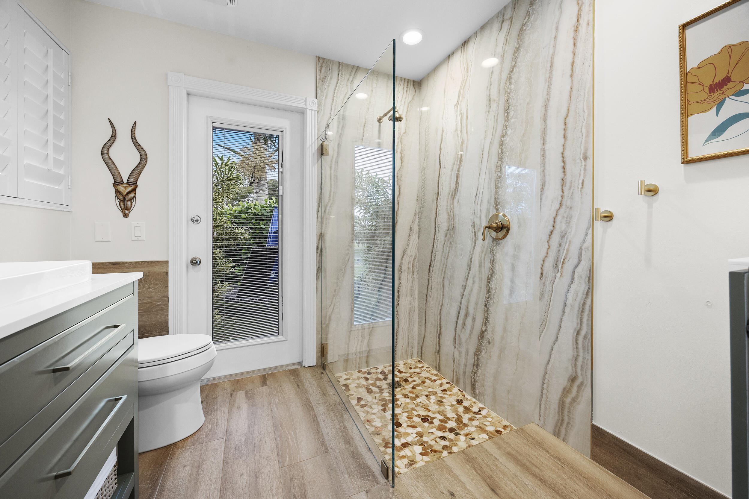 1568 Southwest Springfield Court Palm City, FL 34990 - Photo 23 of 31 a bathroom with a shower toilet and sink