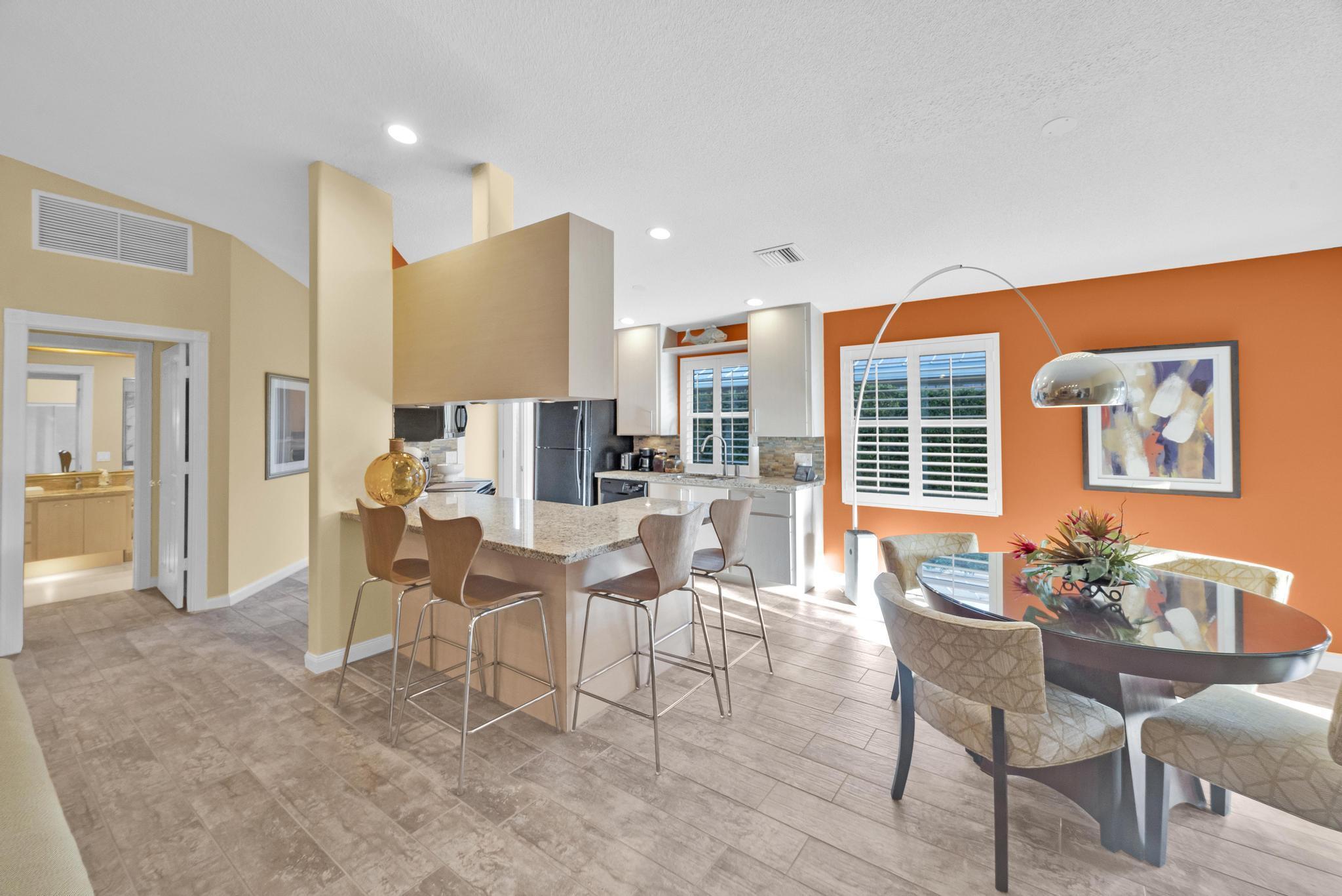 1568 Southwest Springfield Court Palm City, FL 34990 - Photo 8 of 31 a dining room with furniture and wooden floor