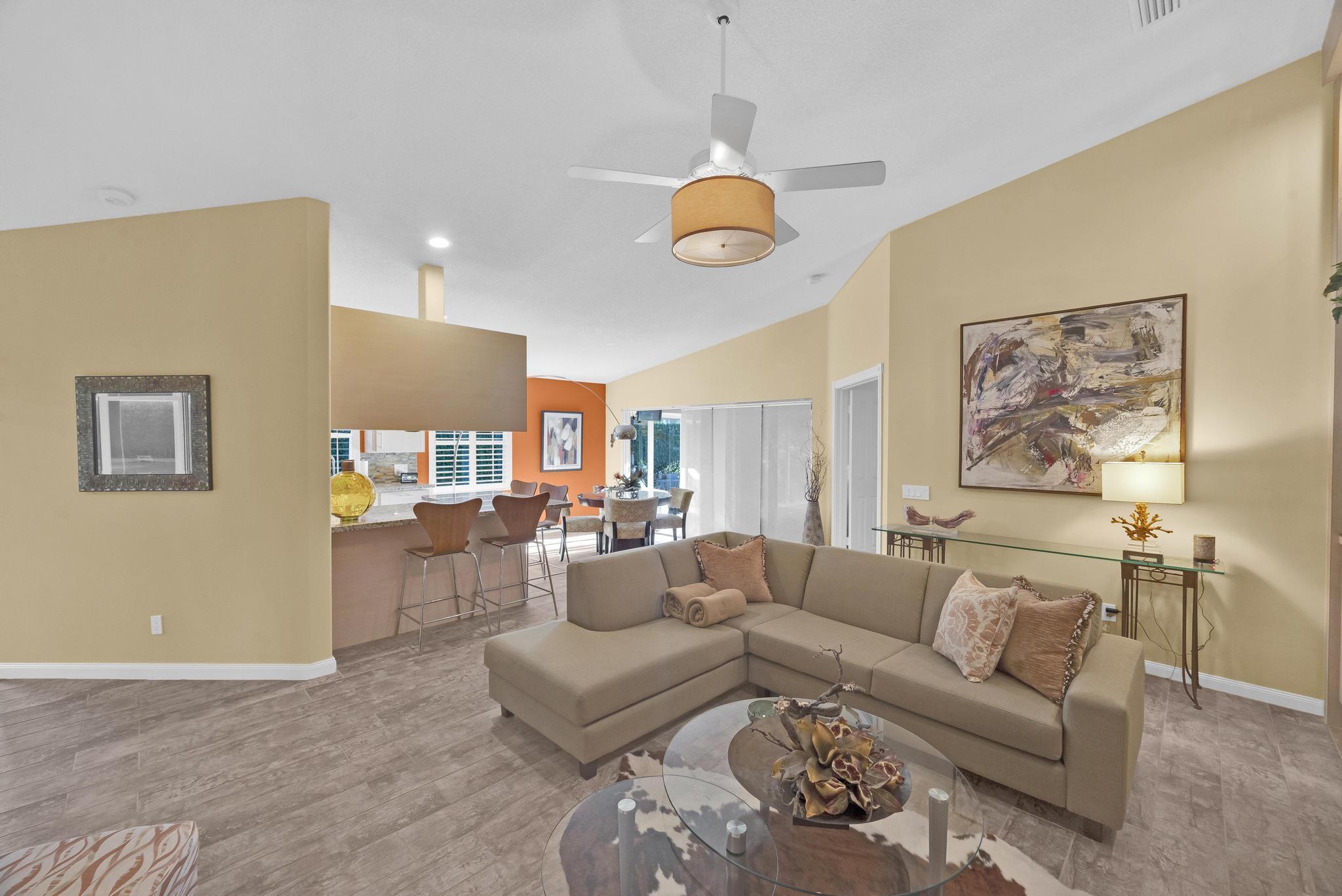 1568 Southwest Springfield Court Palm City, FL 34990 - Photo 9 of 31 a living room with furniture kitchen view and a window