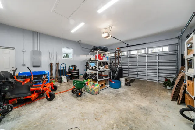 a living room with a fireplace and a book shelf