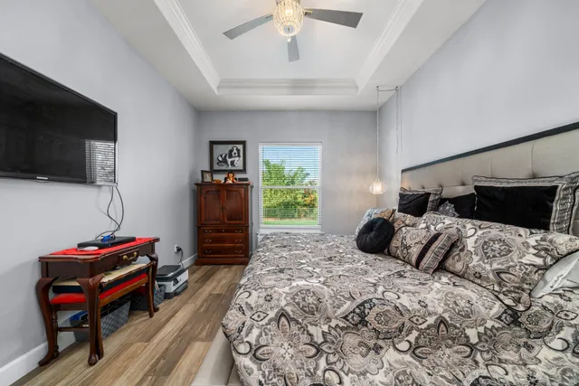 a bedroom with a bed and a dresser