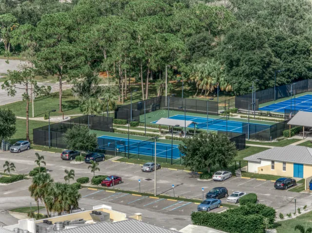 a view of a golf course with a lake view