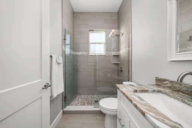 a view of a double vanity sink and a mirror in a room