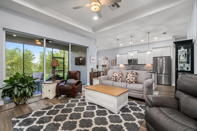 a view of living room kitchen island dining table and microwave