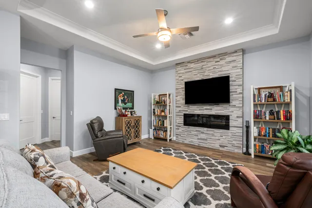a kitchen with granite countertop a refrigerator stove and microwave