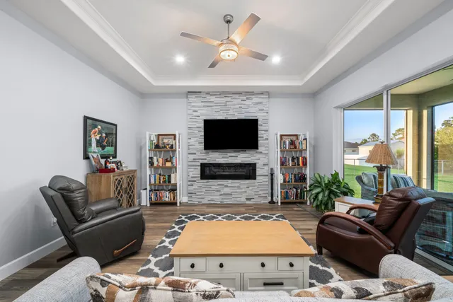 a kitchen with granite countertop stainless steel appliances and wooden floor