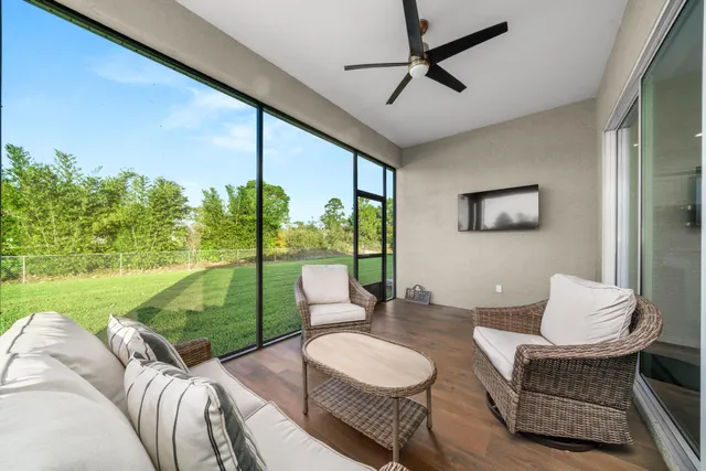 a living room with furniture and a garden