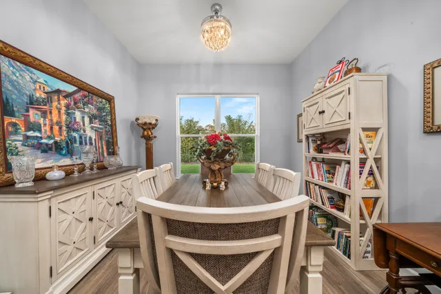 a dining room with furniture and window