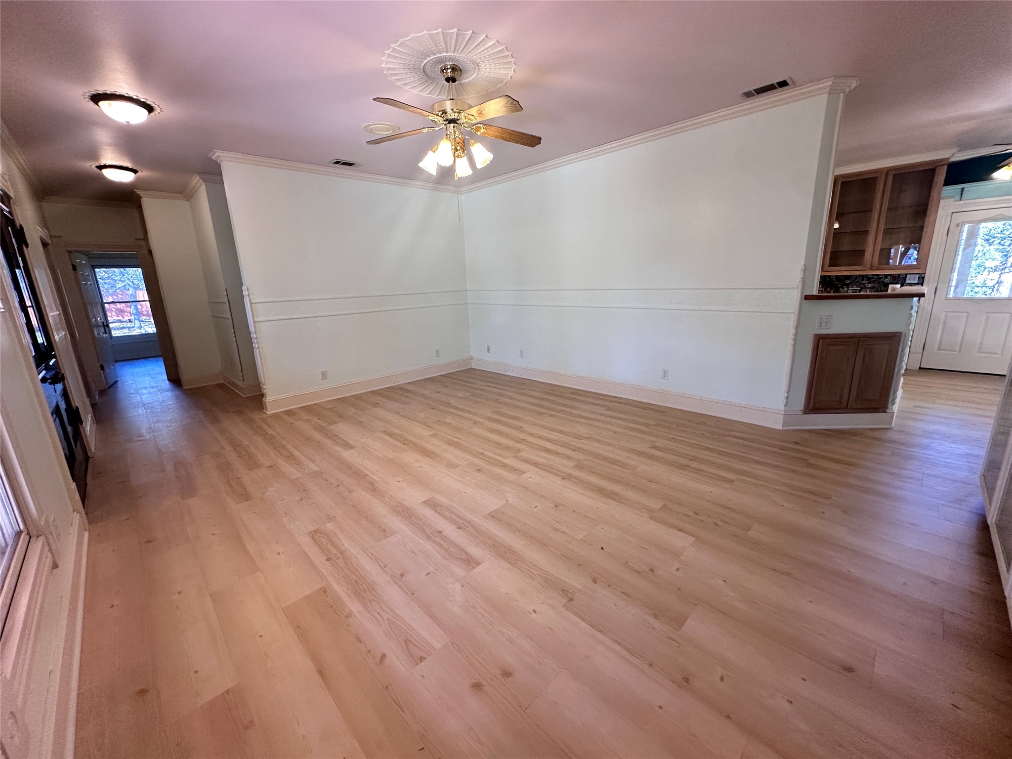 7130 Ranch 2338 Road Georgetown, TX 78633 - Photo 20 of 35 Gleaming wood floors anchor an airy, versatile layout with classic crown molding.