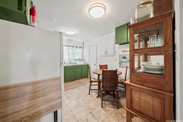a kitchen with a table and chairs