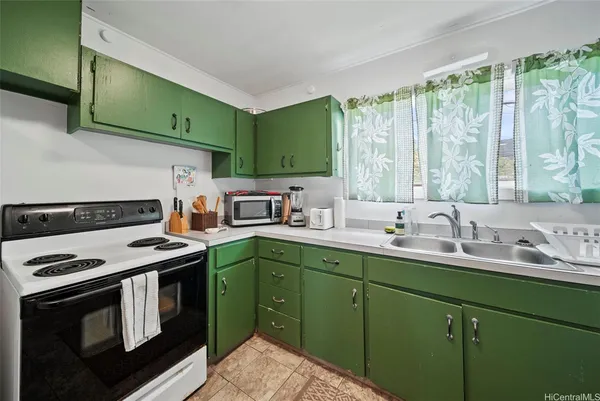 a kitchen with a sink stove and cabinets