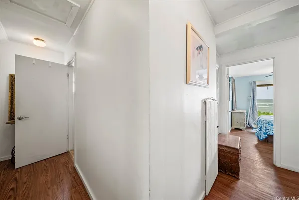 a view of hallway with wooden floor