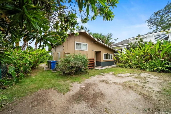 a house with a tree in front of it