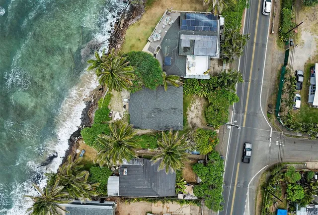 an aerial view of a house with a yard
