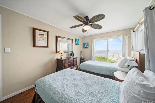 a bed room with a bed window and a desk