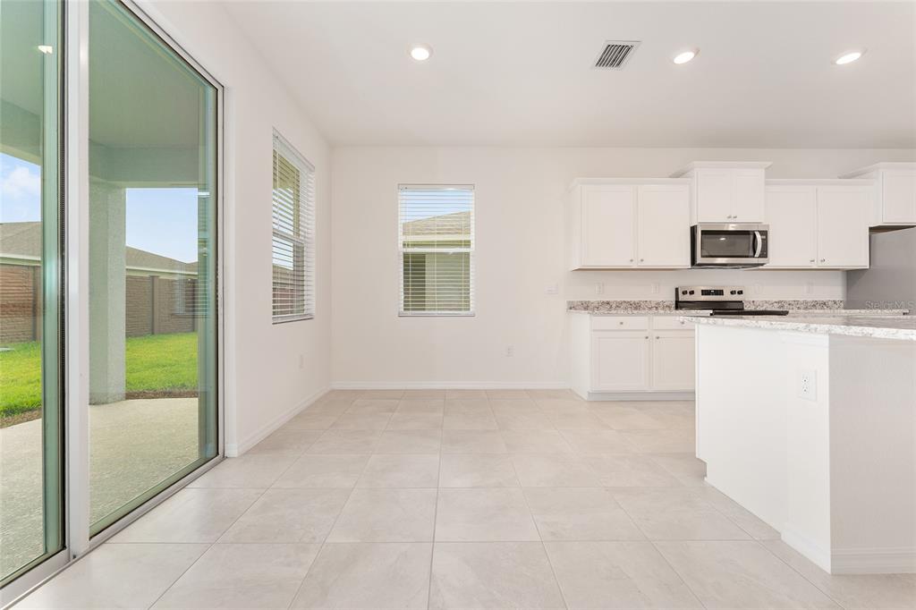 4062 Northwest 48th Terrace Ocala, FL 34482 - Photo 30 of 81 a view of kitchen with stainless steel appliances granite countertop a stove a sink and a refrigerator