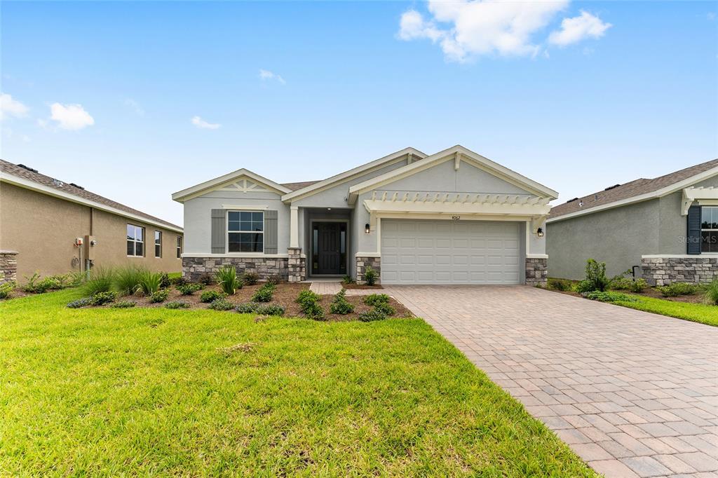 4062 Northwest 48th Terrace Ocala, FL 34482 - Photo 4 of 81 a front view of a house with yard and green space
