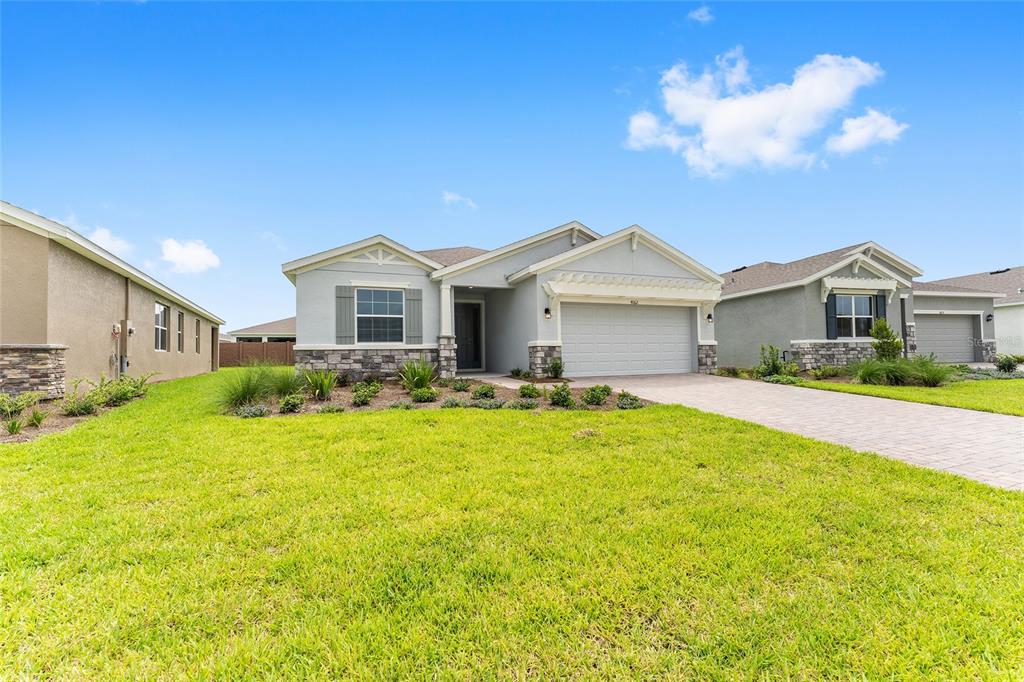 4062 Northwest 48th Terrace Ocala, FL 34482 - Photo 7 of 81 a front view of a house with a yard