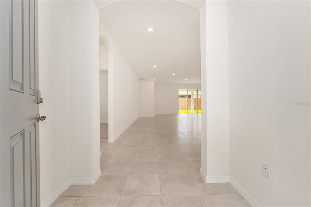 4062 Northwest 48th Terrace Ocala, FL 34482 - Photo 10 of 81 a view of a hallway with wooden floor