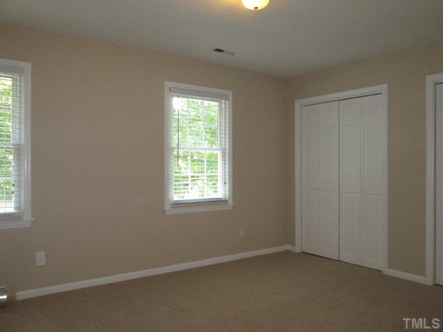 7205 St Ledger Drive Raleigh, NC 27613 - Photo 22 of 25 Nice sized bedroom with double closets! New Carpet! NEW paint! NEW light! Two inch blinds! Most door knobs in home have been updated to the brush nickel theme as well!
