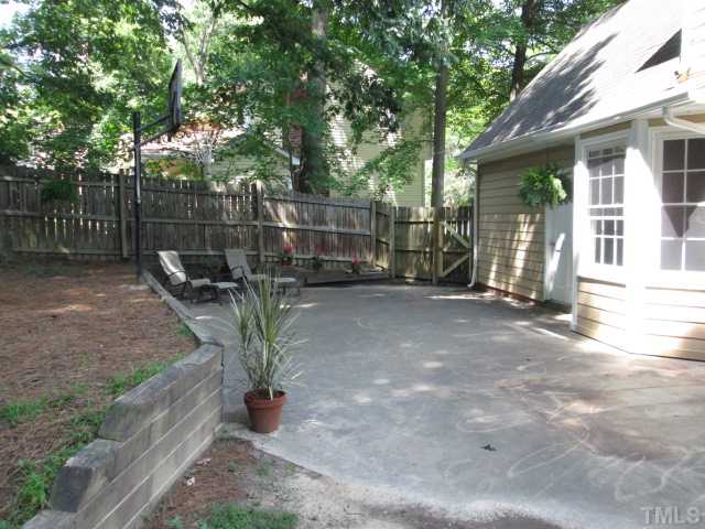 The back yard is fenced in and has a nice sized patio as well. A nice place to put your favorite outdoor furniture and relax in the shade of the trees! NEW outside paint and new outside lighting!
