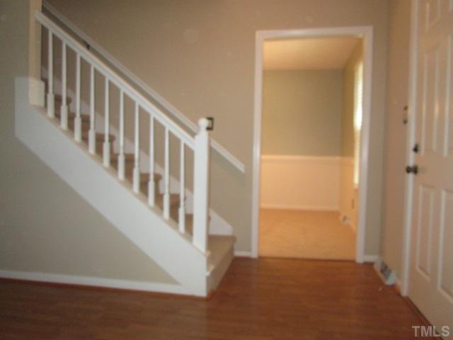 7205 St Ledger Drive Raleigh, NC 27613 - Photo 8 of 25 Foyer area features updated laminate flooring! New paint and NEW light also!
