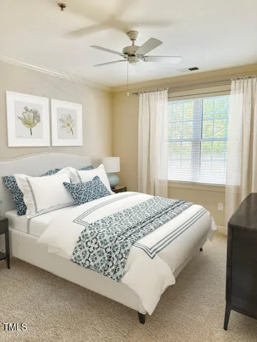 a bedroom with a bed and window