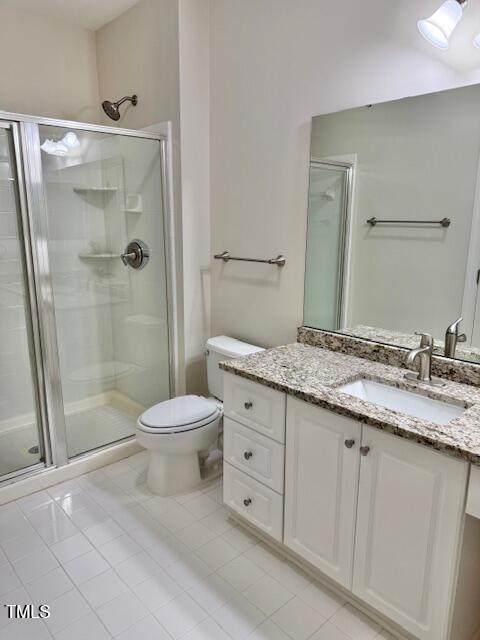 100 Northbrook Drive, Unit 205 Raleigh, NC 27609 - Photo 19 of 34 a bathroom with a granite countertop sink a toilet and shower