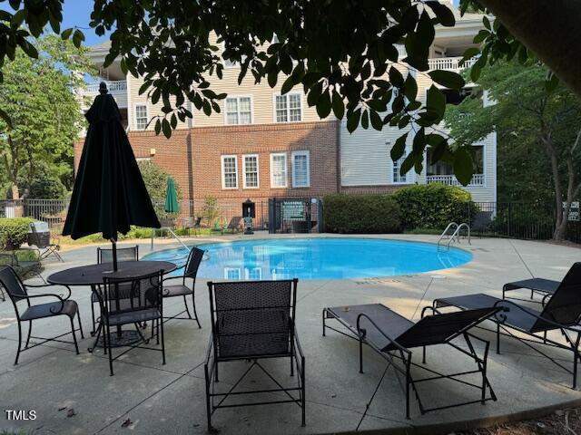 100 Northbrook Drive, Unit 205 Raleigh, NC 27609 - Photo 30 of 34 a view of house with backyard outdoor seating area and furniture