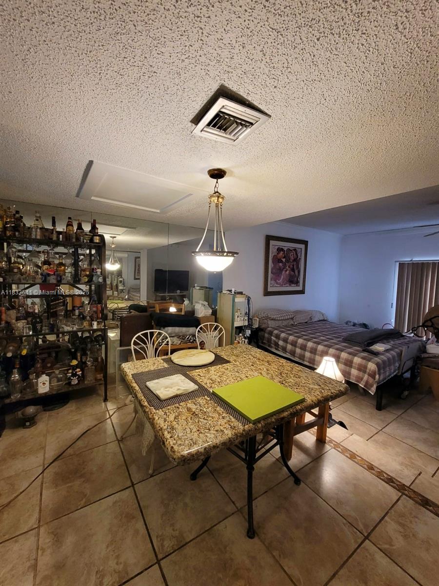 11 Olive Drive, Unit J Hialeah, FL 33010 - Photo 17 of 20 a living room with furniture and pool table
