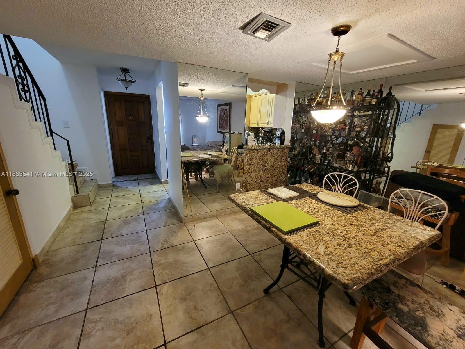 11 Olive Drive, Unit J Hialeah, FL 33010 - Photo 18 of 20 a view of a livingroom with furniture and window