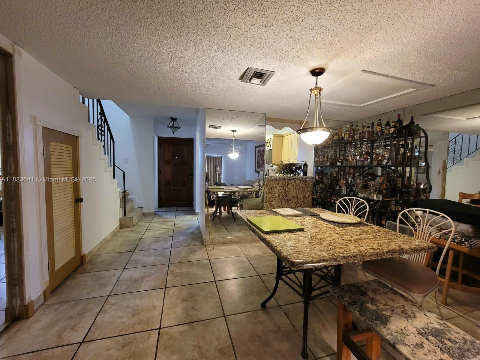11 Olive Drive, Unit J Hialeah, FL 33010 - Photo 19 of 20 a view of a dining room with furniture