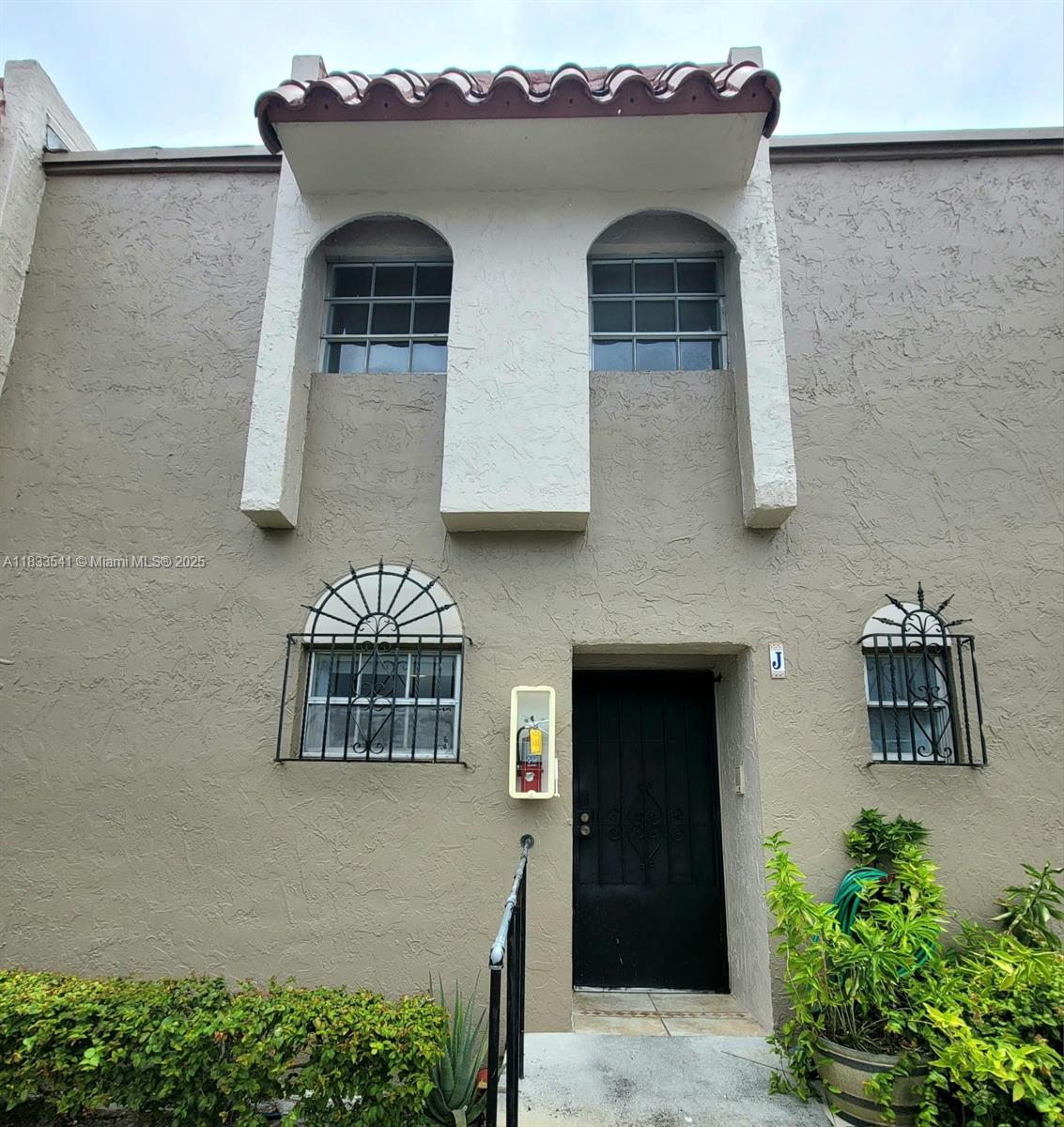 11 Olive Drive, Unit J Hialeah, FL 33010 - Photo 2 of 20 a front view of a house