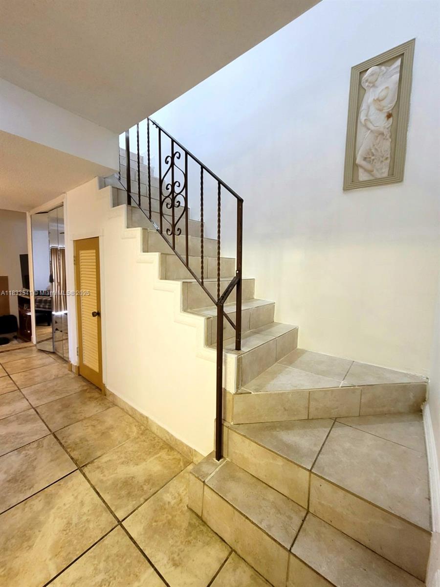 11 Olive Drive, Unit J Hialeah, FL 33010 - Photo 4 of 20 a view of entryway and hall